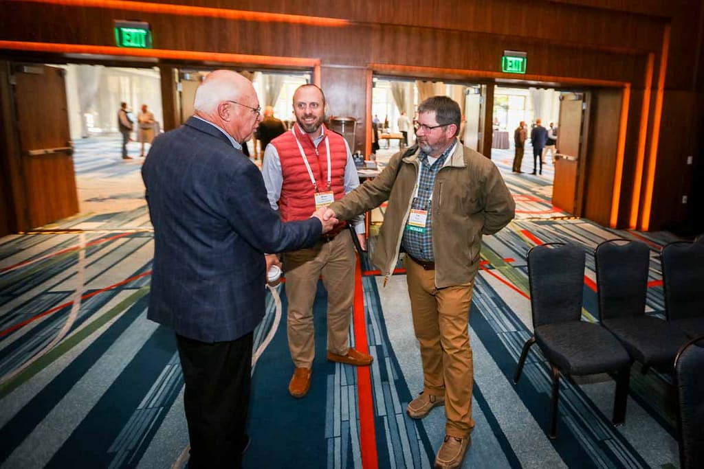 Photos of corporate people on stage